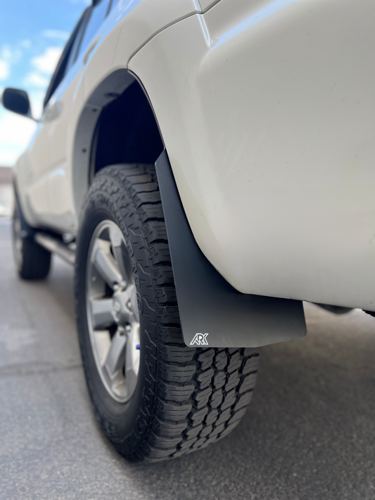 White 5th gen Toyota 4Runner front wheel with ARK splash guard in the wheel well