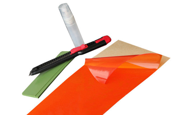 Lamin-X universal protective film sheet in amber.